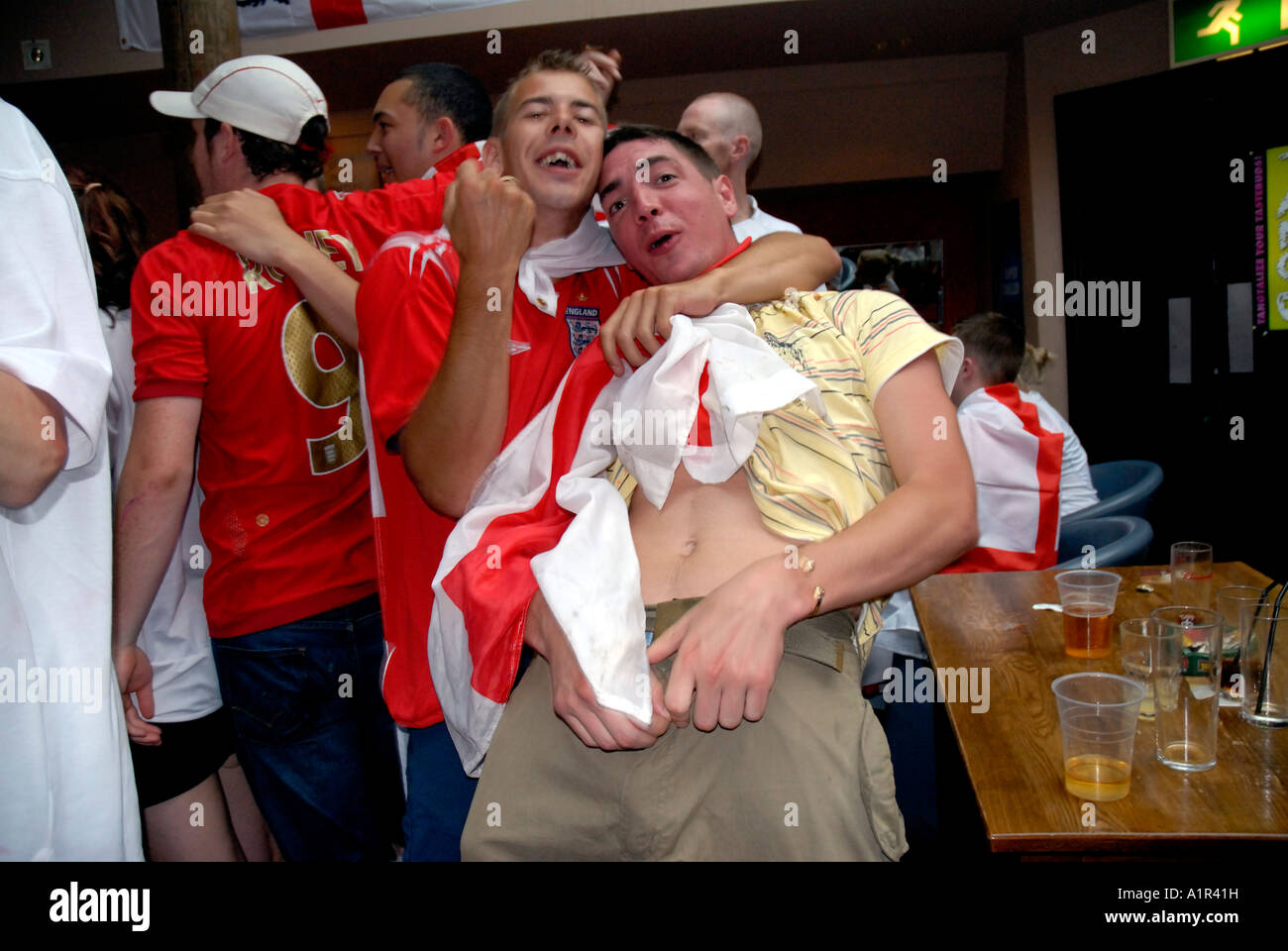 Young English football fans drinking and behaving badly in West end pubs whilst watching World cup  match. Stock Photo