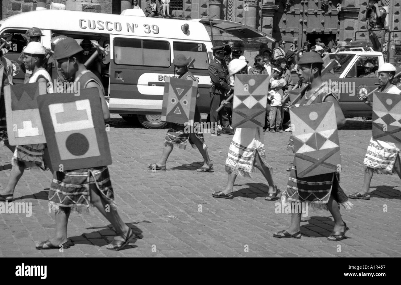 Street public square parade power display outdoor faceless anonymous man men boy same clone Cuzco Peru South Latin America Stock Photo