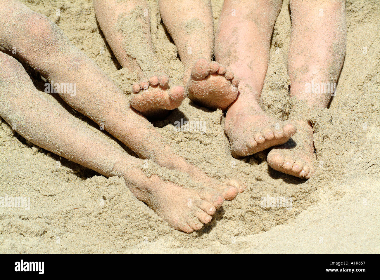 Feet in the Sand Stock Photo