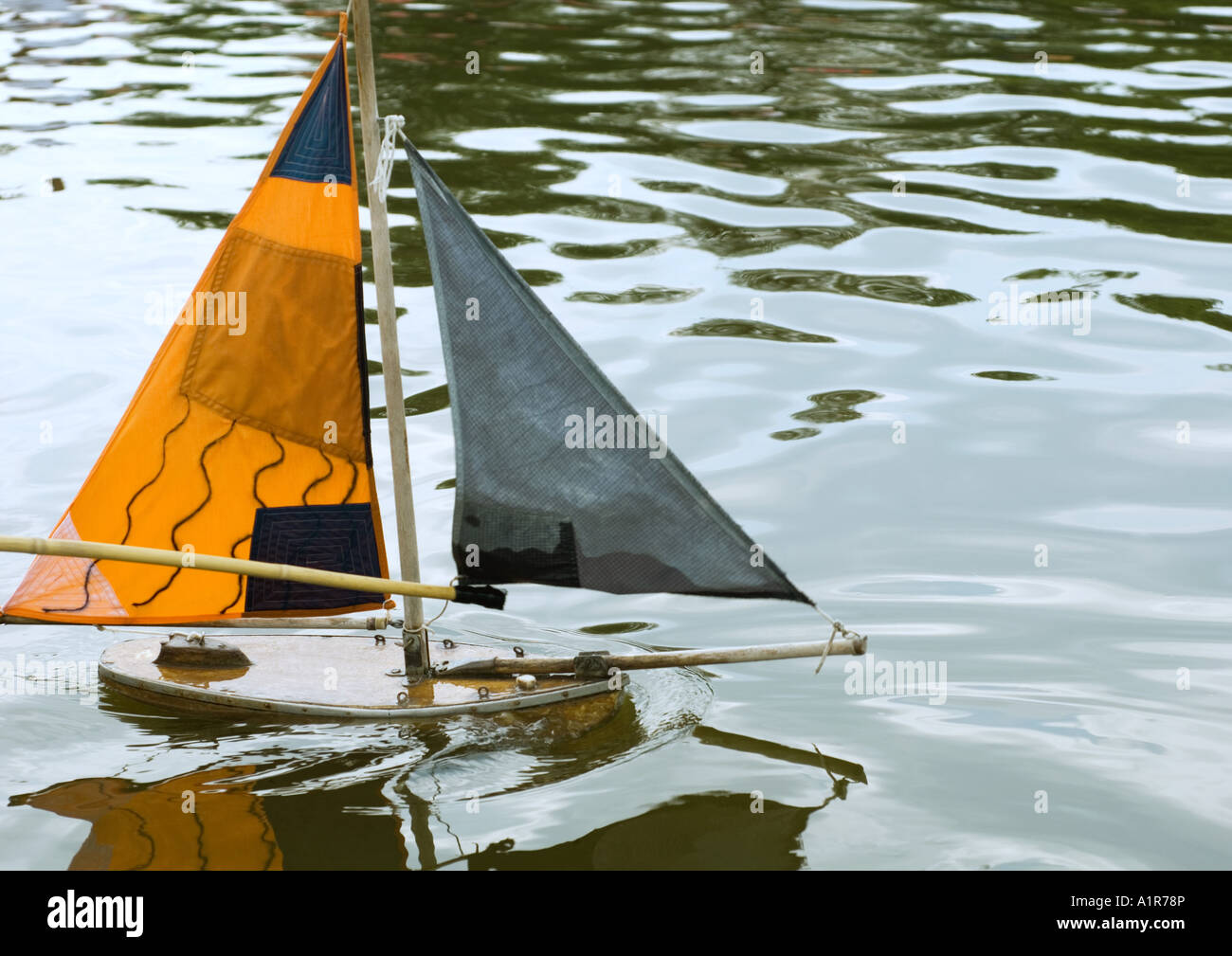 Toy boat in water Stock Photo - Alamy
