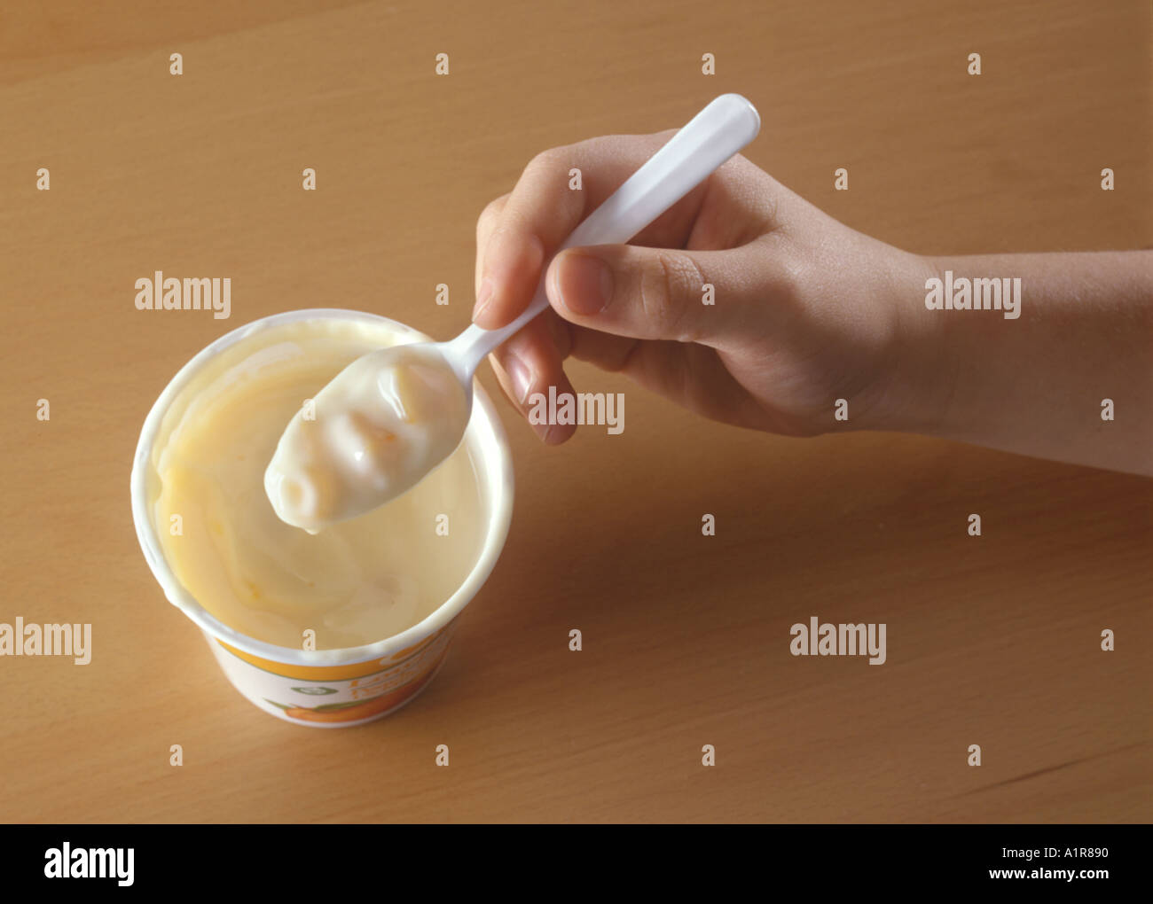 Child Eating Yogurt Stock Photo - Alamy