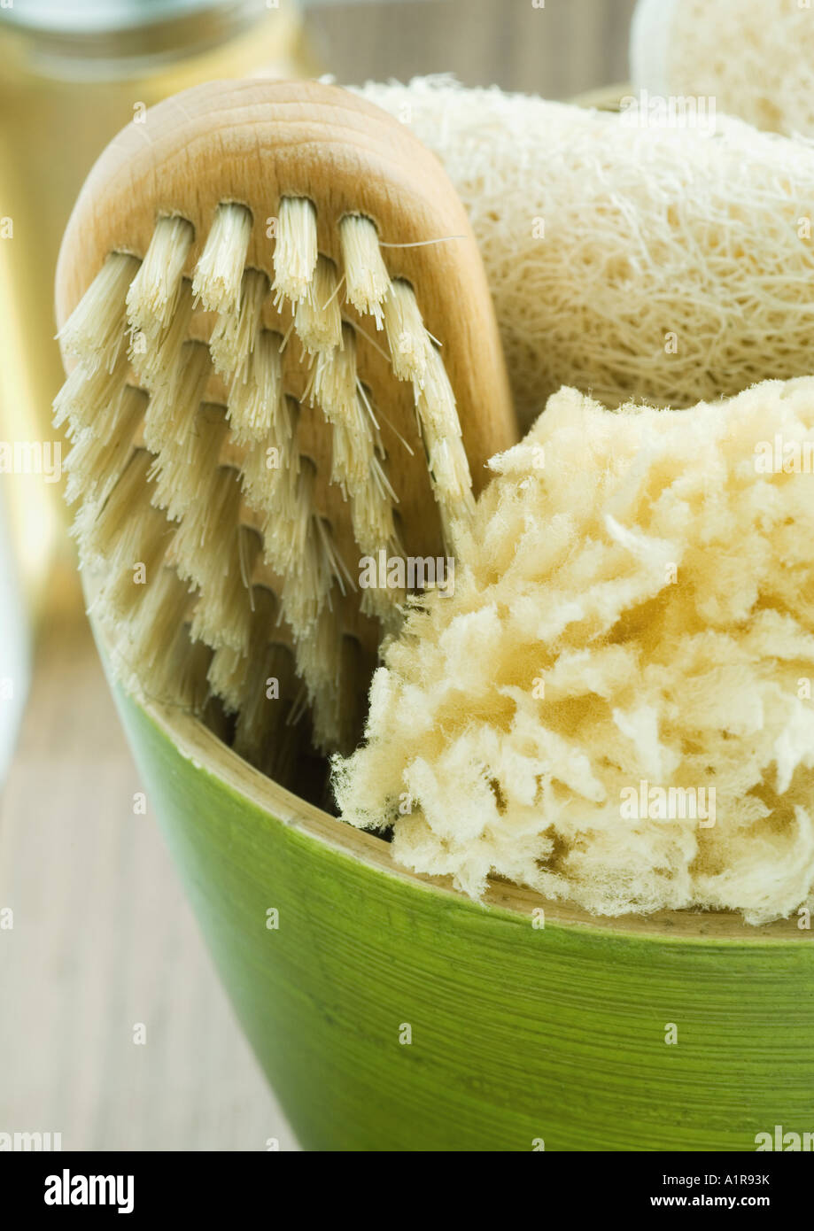 Bowl containing bath sponges and brush Stock Photo Alamy