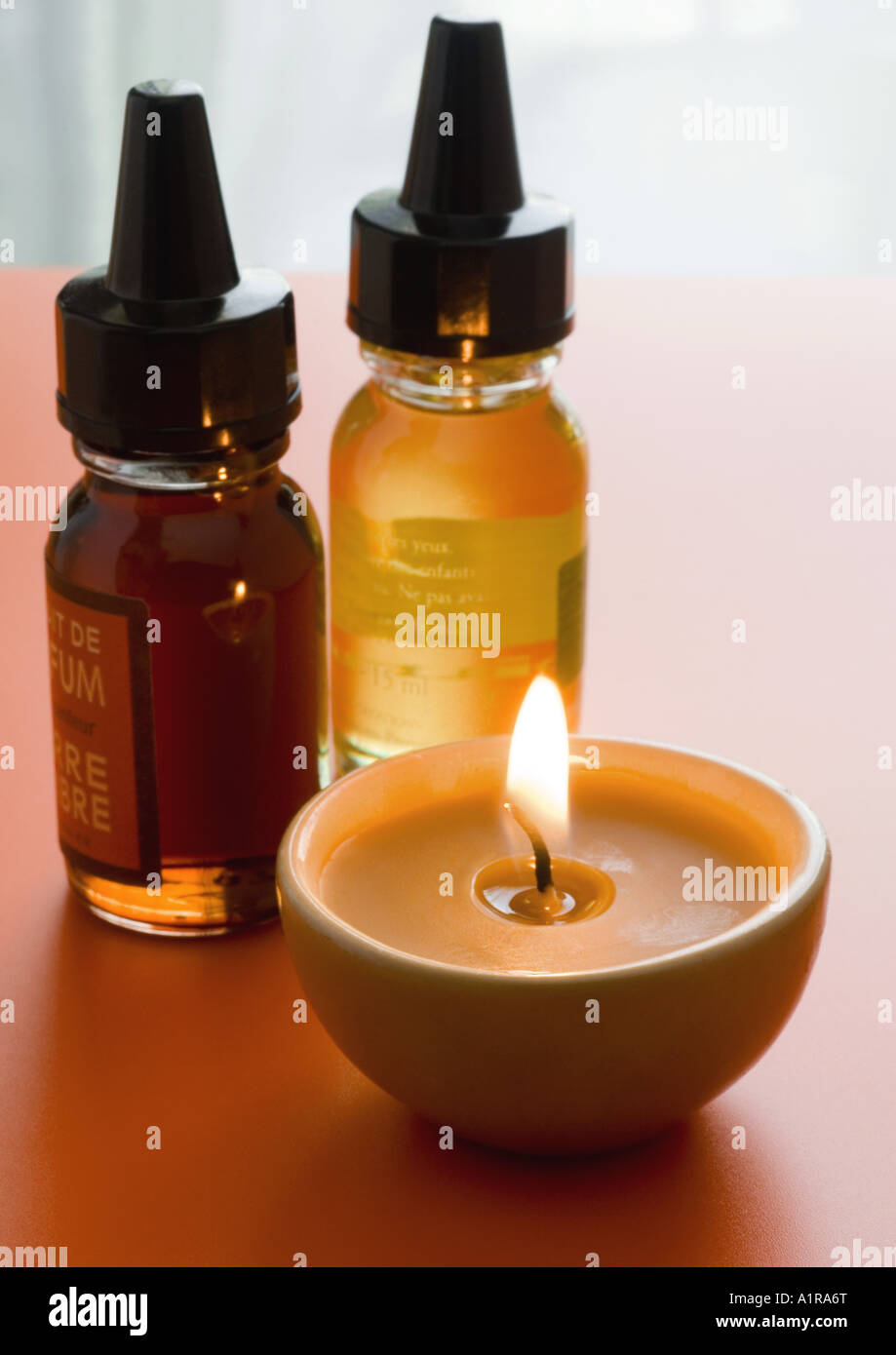 Bottles of scented oils and candle Stock Photo