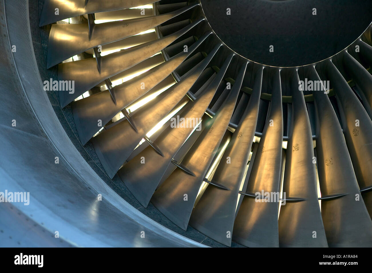 tight view of passenger jet engine intake blades Stock Photo