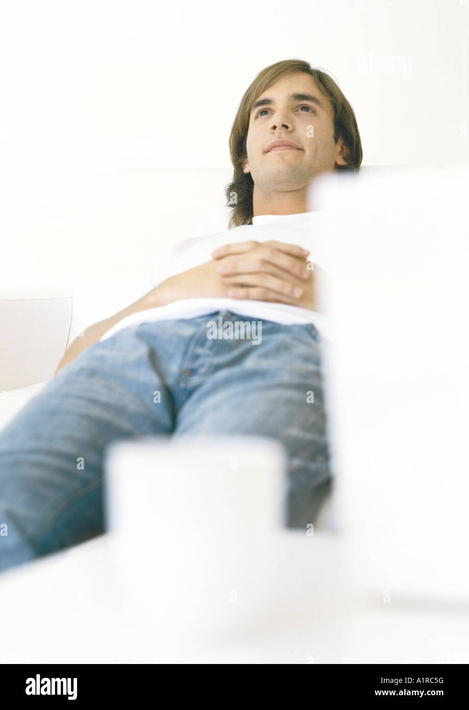 Man lying down, looking up Stock Photo Alamy