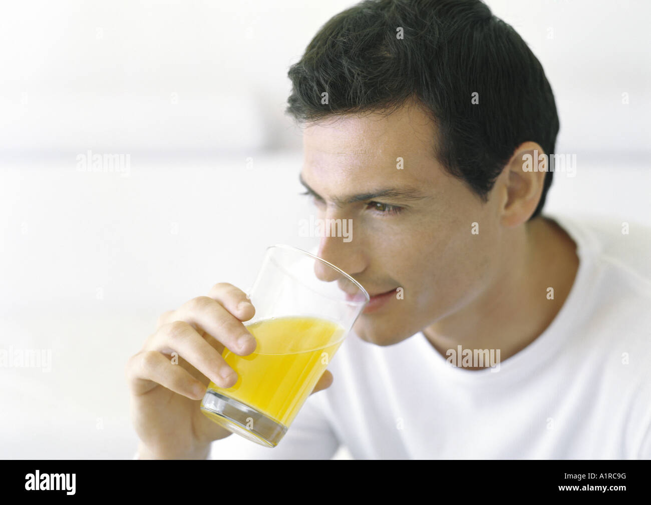 Man drinking juice Stock Photo Alamy