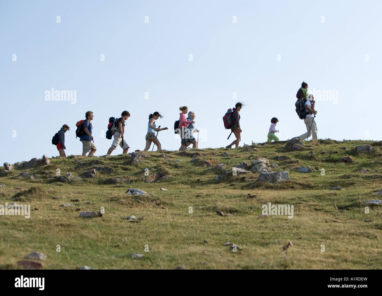 Hikers walking in line Stock Photo Alamy