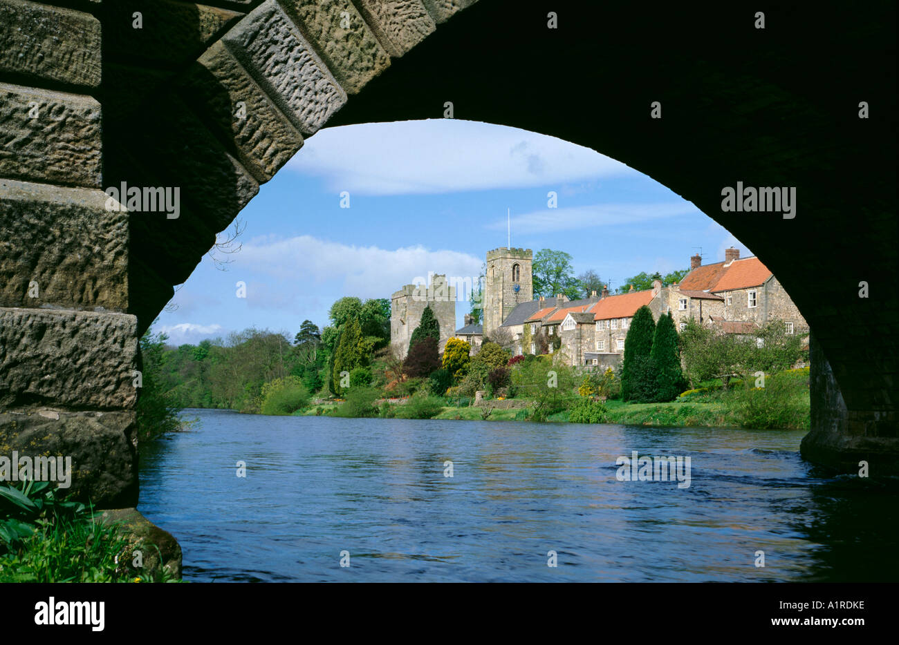 Marmion Tower and church seen over River Ure, West Tanfield, near Masham, North Yorkshire, England, UK. Stock Photo