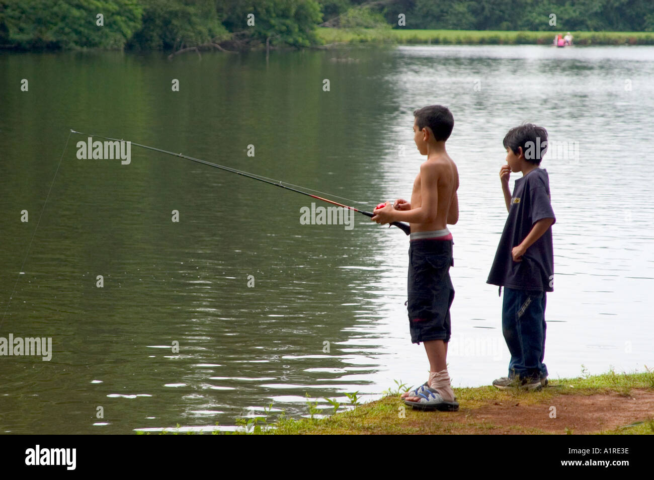 Two boys lake fishing hi-res stock photography and images - Alamy