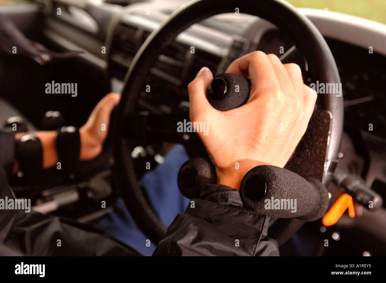 A MOTOR CARS DRIVING CONTROLS ADAPTED FOR A DISABLED DRIVER Stock Photo