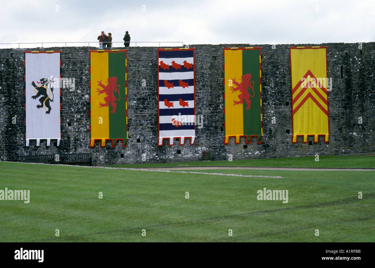 Flags and banners in the courtyard of Pembroke Castle Dyfed Wales Stock Photo