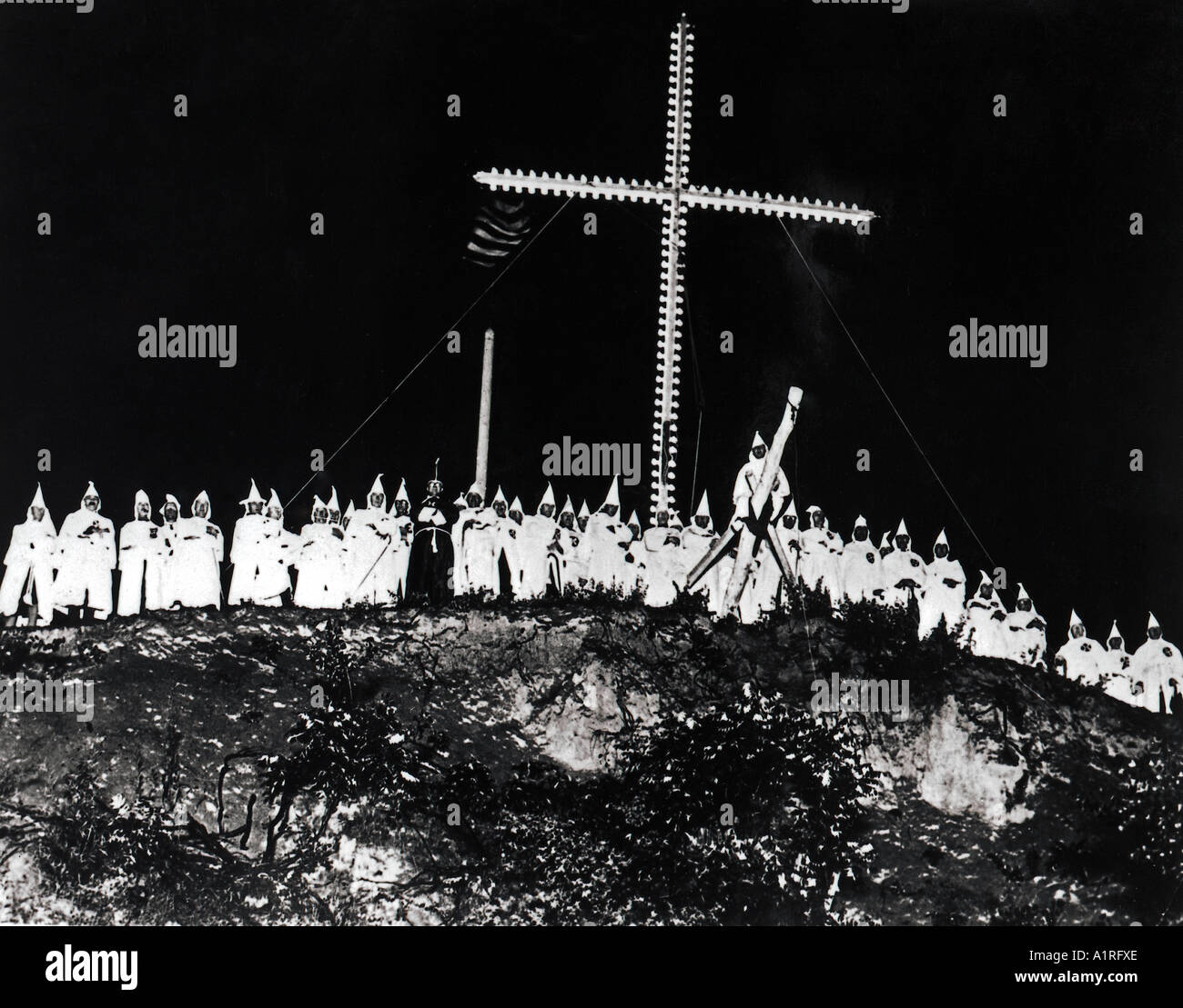 Ku Klux Klan rally under a large cross Stock Photo