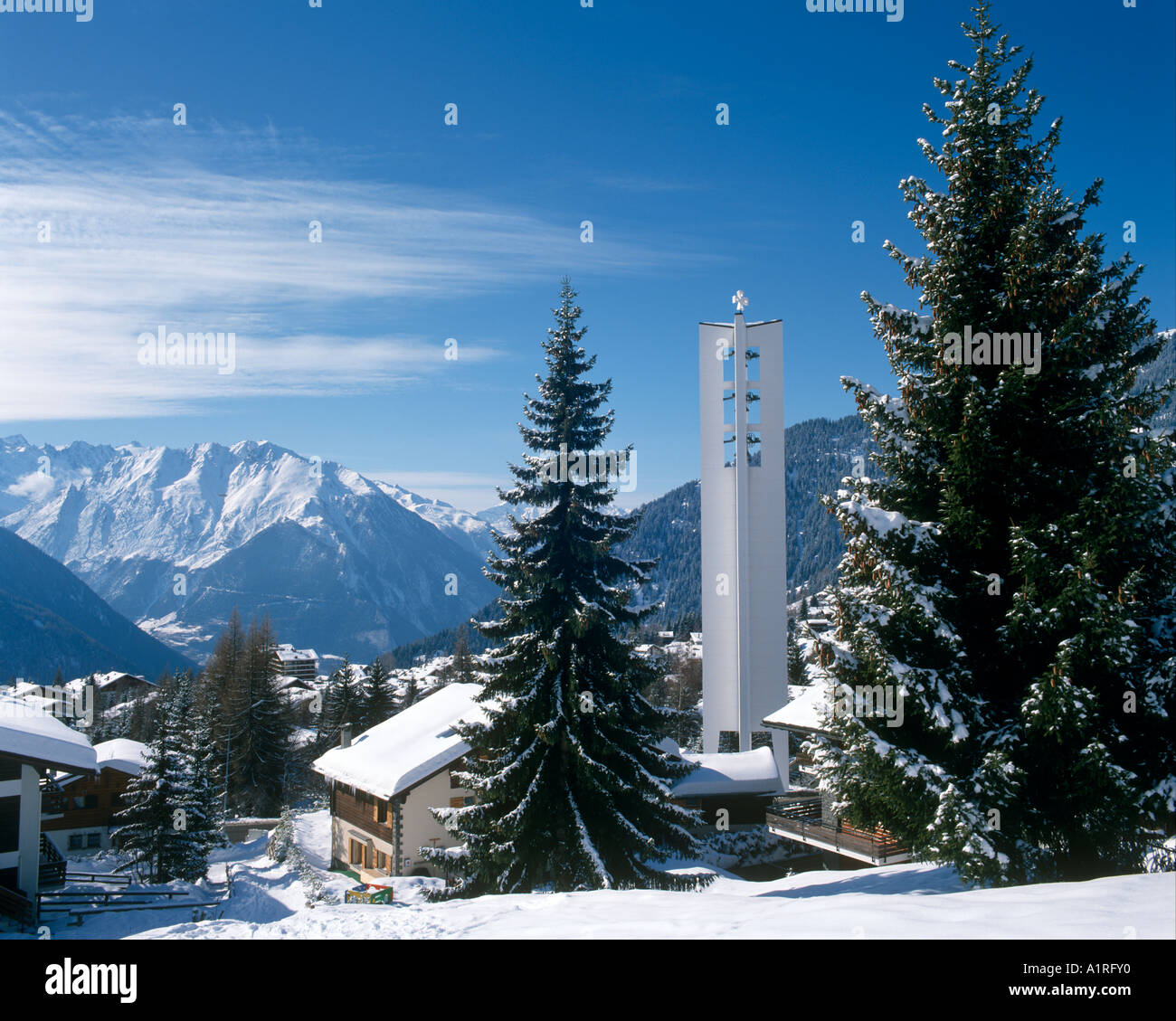 View over the resort of Verbier with church steeple in the foreground, Bernese Alps, Switzerland Stock Photo