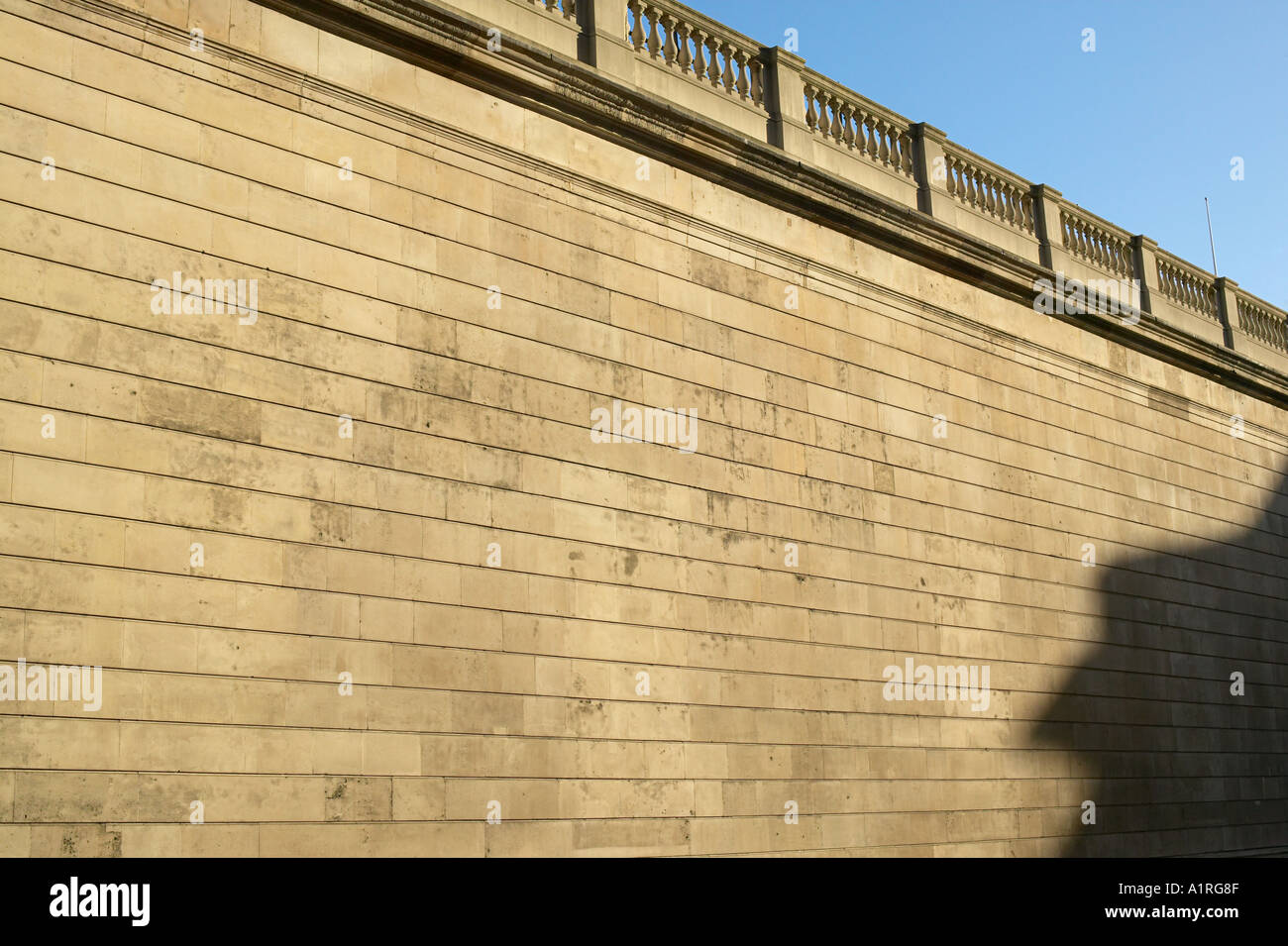 stone wall on west side of bank of england with shadow Stock Photo