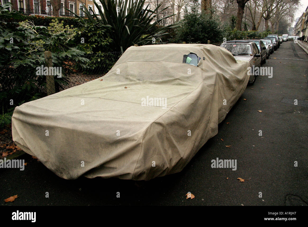 big car under wraps Stock Photo