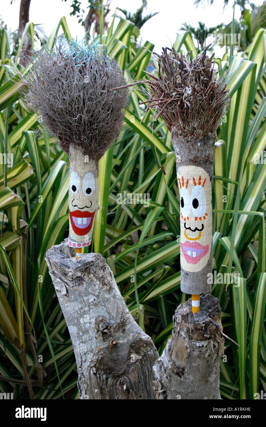Greeters Two Painted Carvings Decorate A Palm Tree Stump Greet