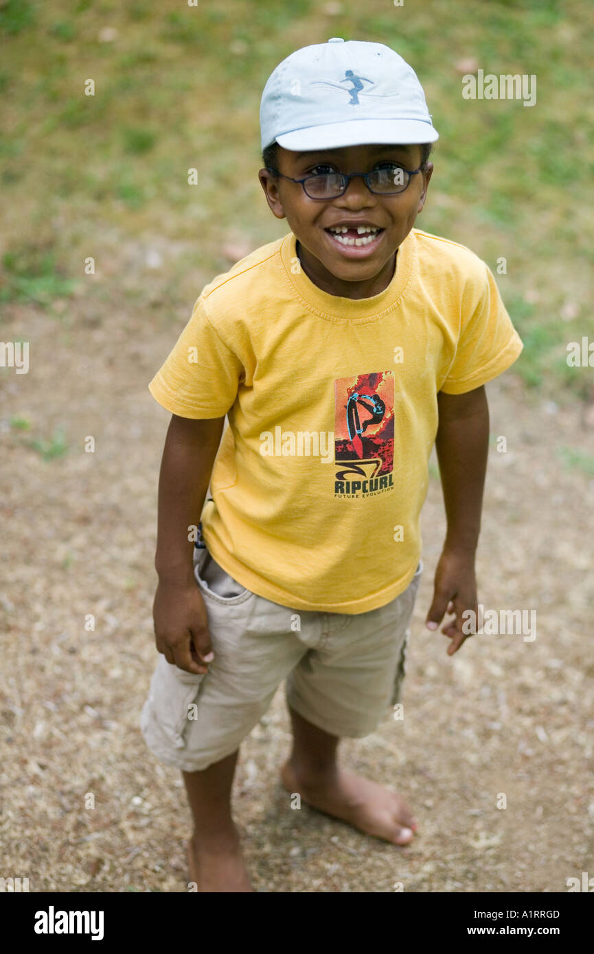 laughing black boy with baseball cap Stock Photo