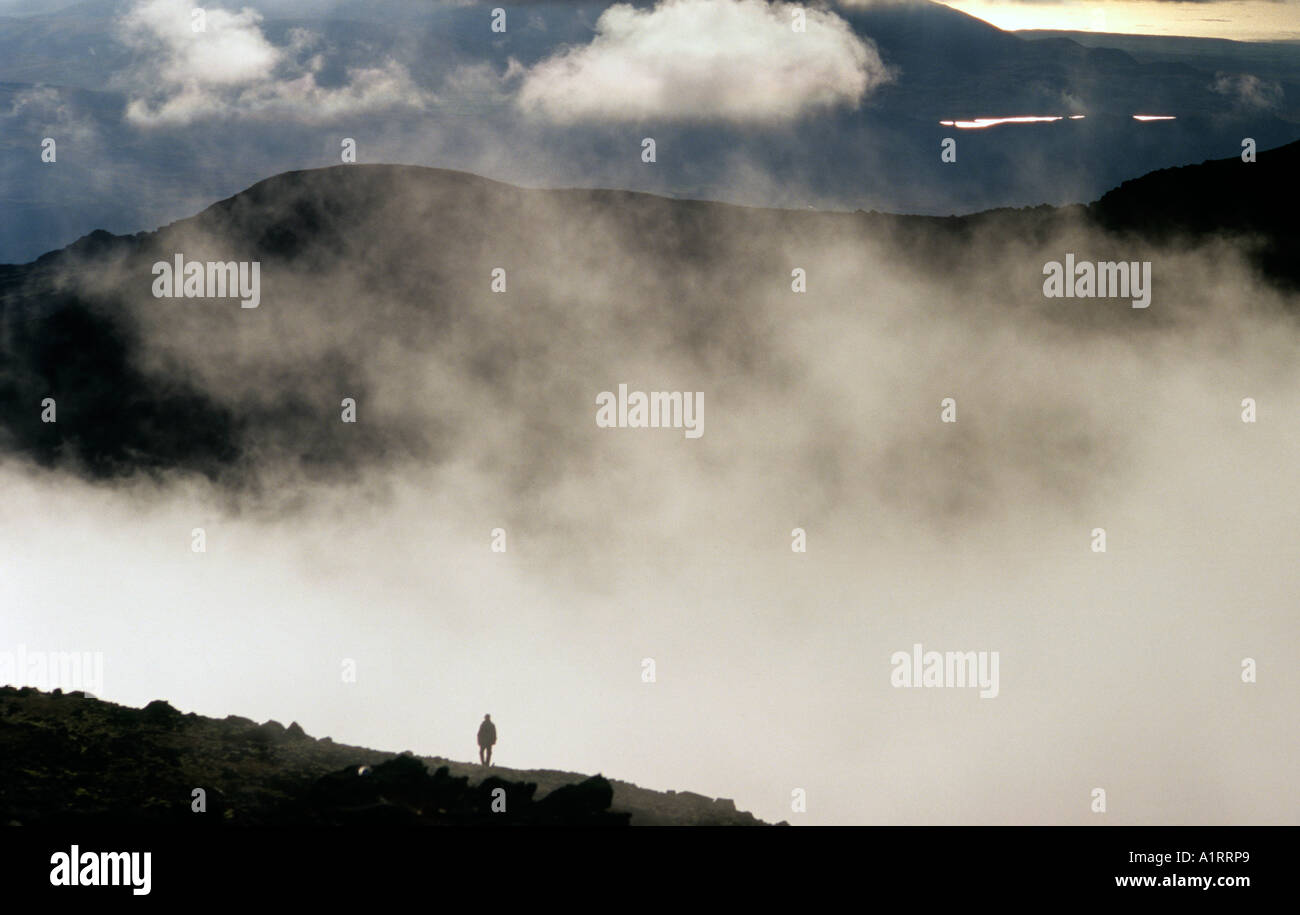 Mountaineer decending the summit of Scarfell Pike Lake District UK Stock Photo