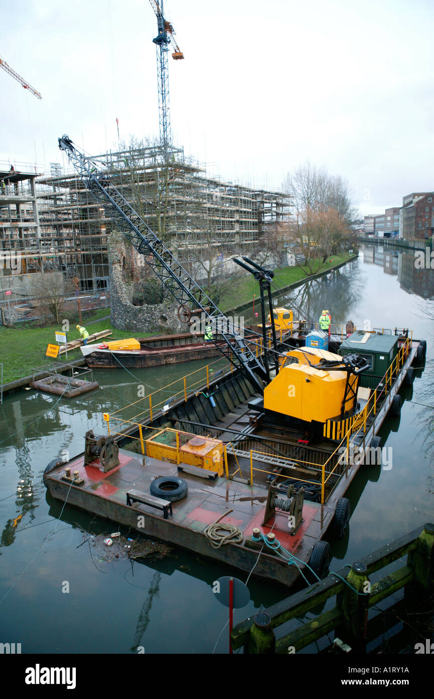 River Crane Construction Site Next to Medieval City Walls River Wensum Norwich UK Stock Photo