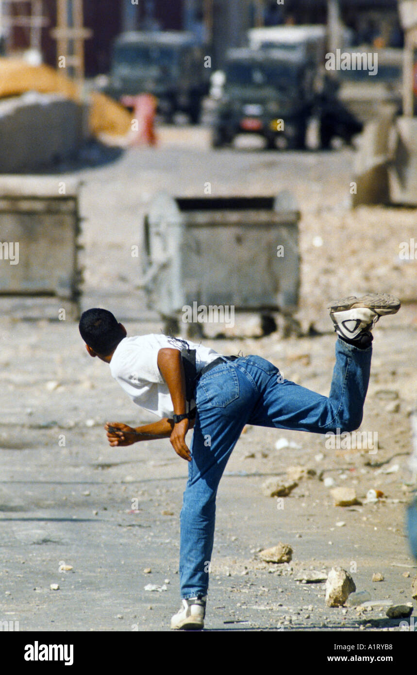 ISRAELI PALESTINIAN CONFLICT PALESTINIAN YOUTH THROWING STONES