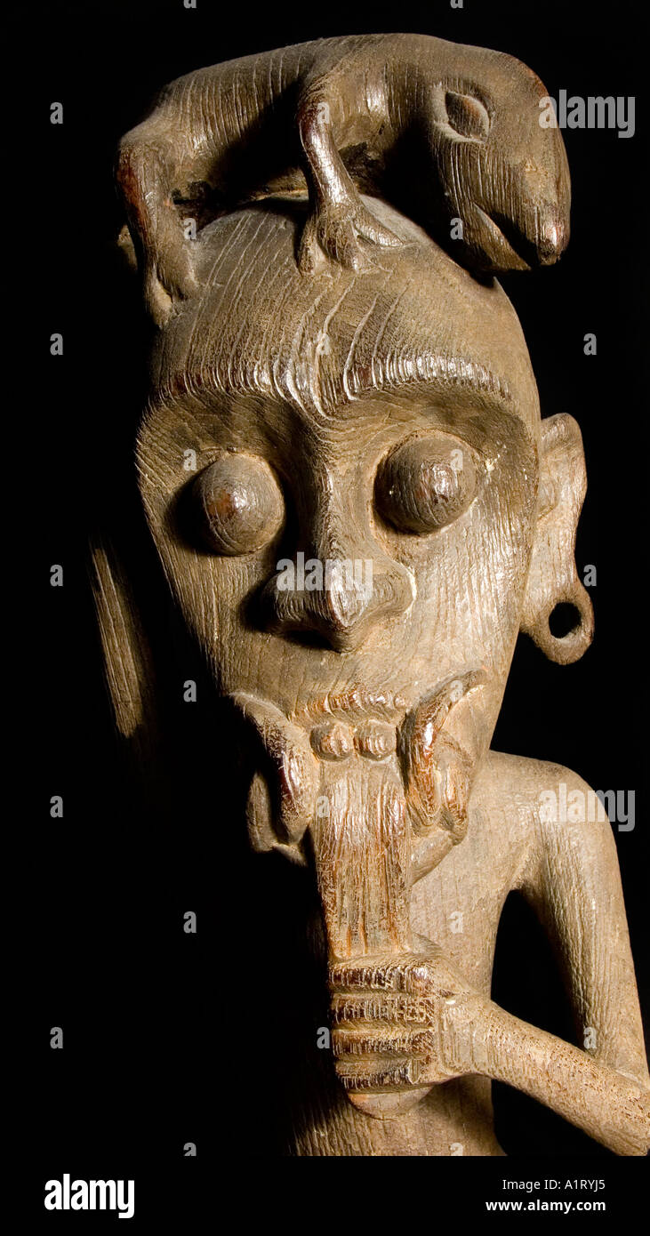 Iban handicraft from Borneo A fearsome carved wooden figurine from Kalimantan Indonesia Stock Photo