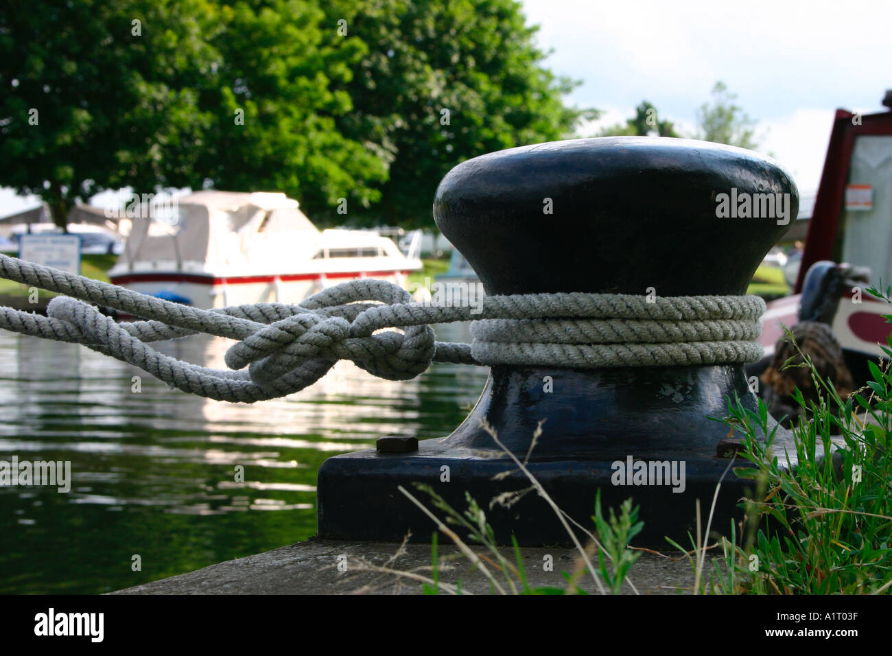 Mooring rope tied to a bollard. Stock Photo