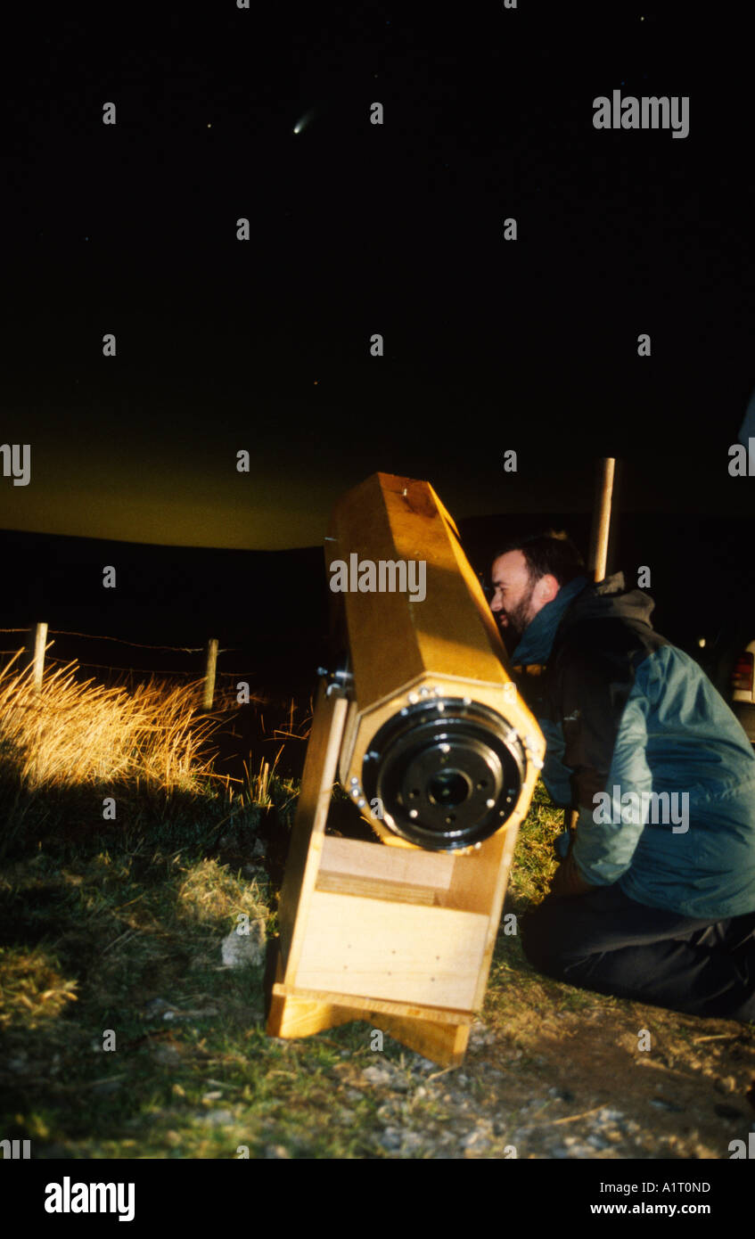 astronomer watching a comet through home made telescope Stock Photo