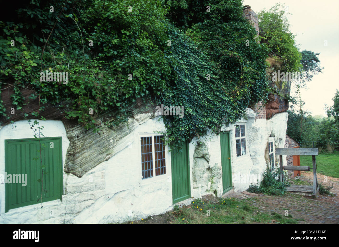 homes carved into sandstone rock at Kinver Midlands UK Stock Photo - Alamy