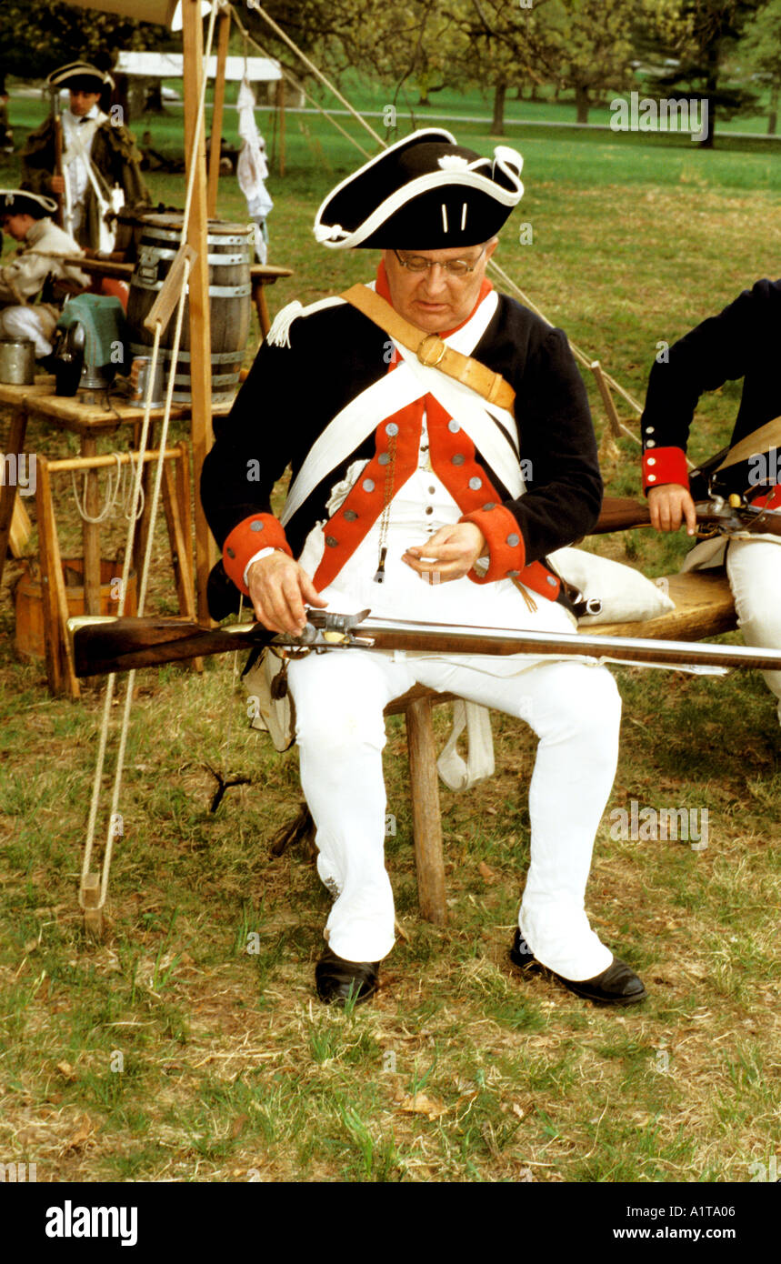 This reenactor wears an American revolutionary uniform and holds a flintlock musket at Valley Forge Pennsylvania USA Stock Photo