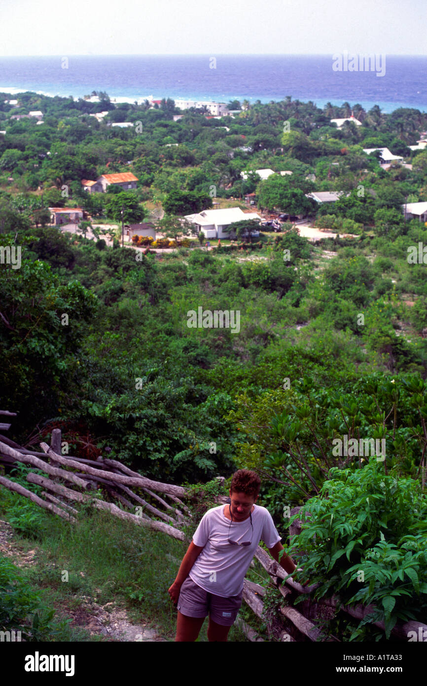 Tourist at Spot Bay climbing up the Bluff Cayman Brac Cayman Islands Stock Photo