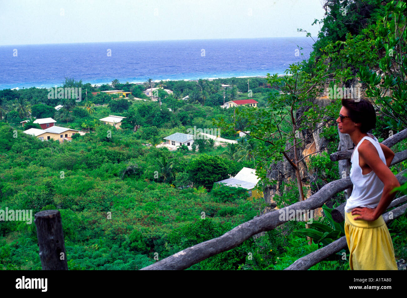 Tourist looking over Spot Bay from the Bluff Cayman Brac Cayman Islands