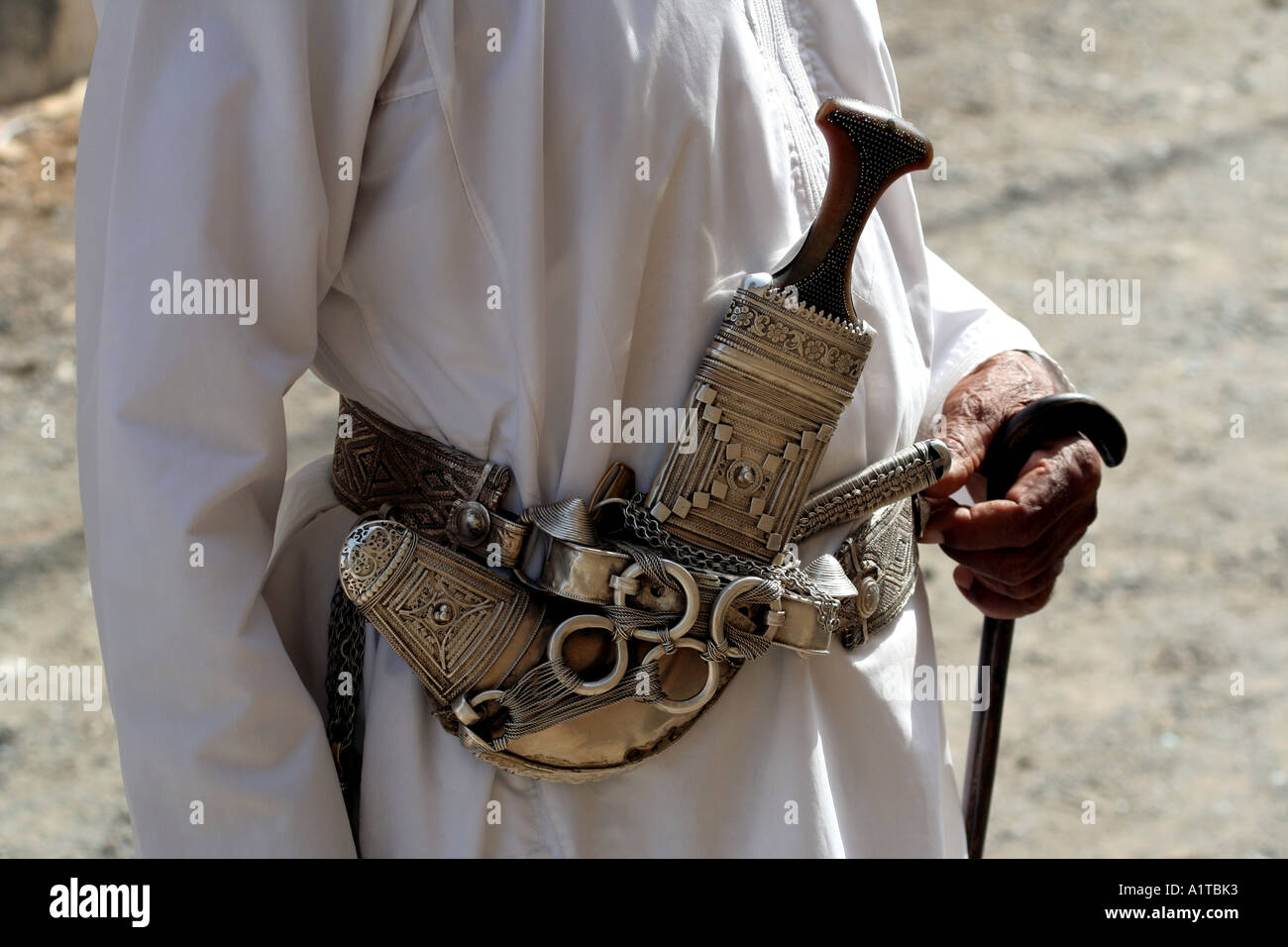 Old Omani man wearing a khanjar in a souq in Sinaw, near Nizwa, Oman Stock Photo