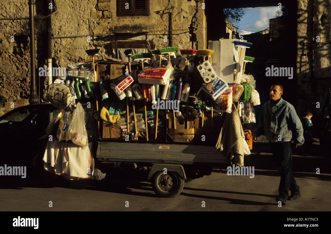 Street salesman and his three wheeled Vespa truck in Palermo Sicily Italy Stock Photo