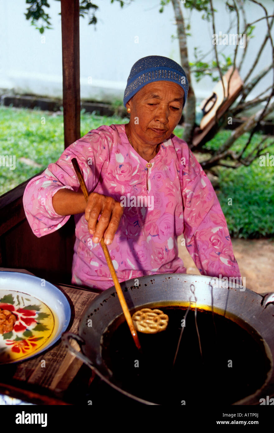 1, one, Malaysian woman, Malay woman, mature woman, old woman, mature woman, food vendor, Mahsuri Mausoleum, Langkawi Island, Kedah State, Malaysia Stock Photo