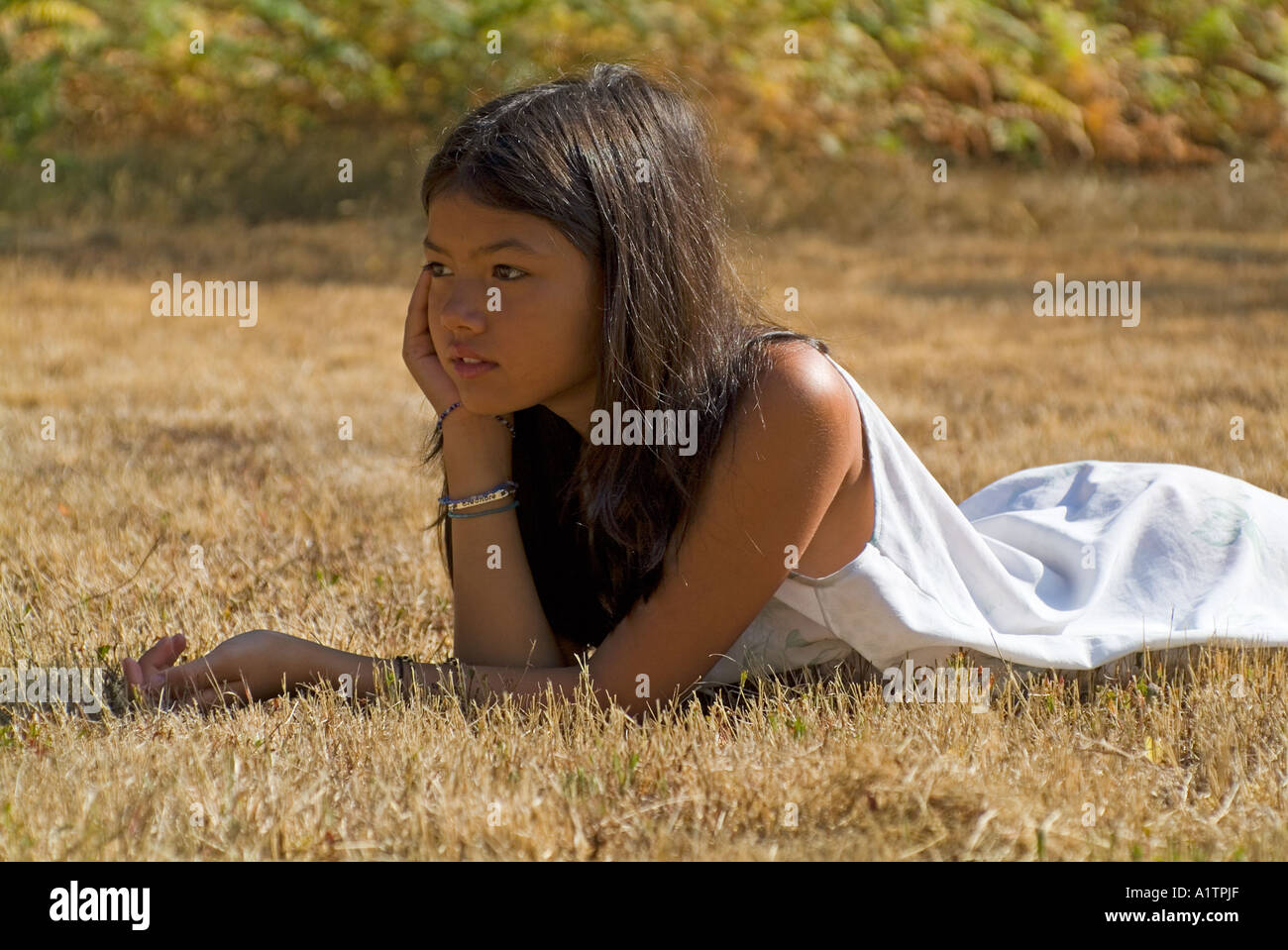 Young teenage girl thinking / thoughtful portrait Stock Photo