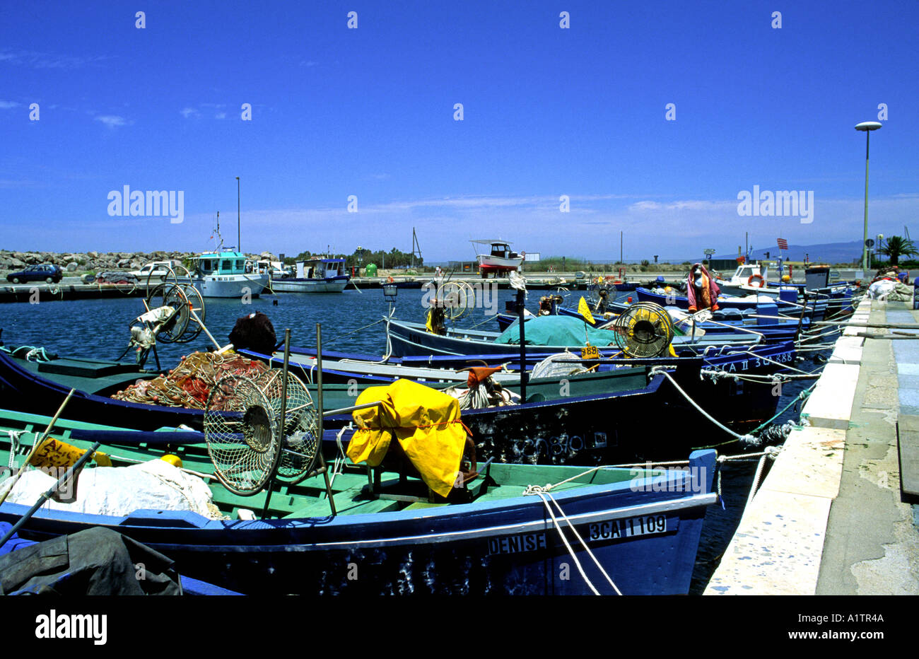 Wooden fish boat in typical colors in sardinia Stock Photo