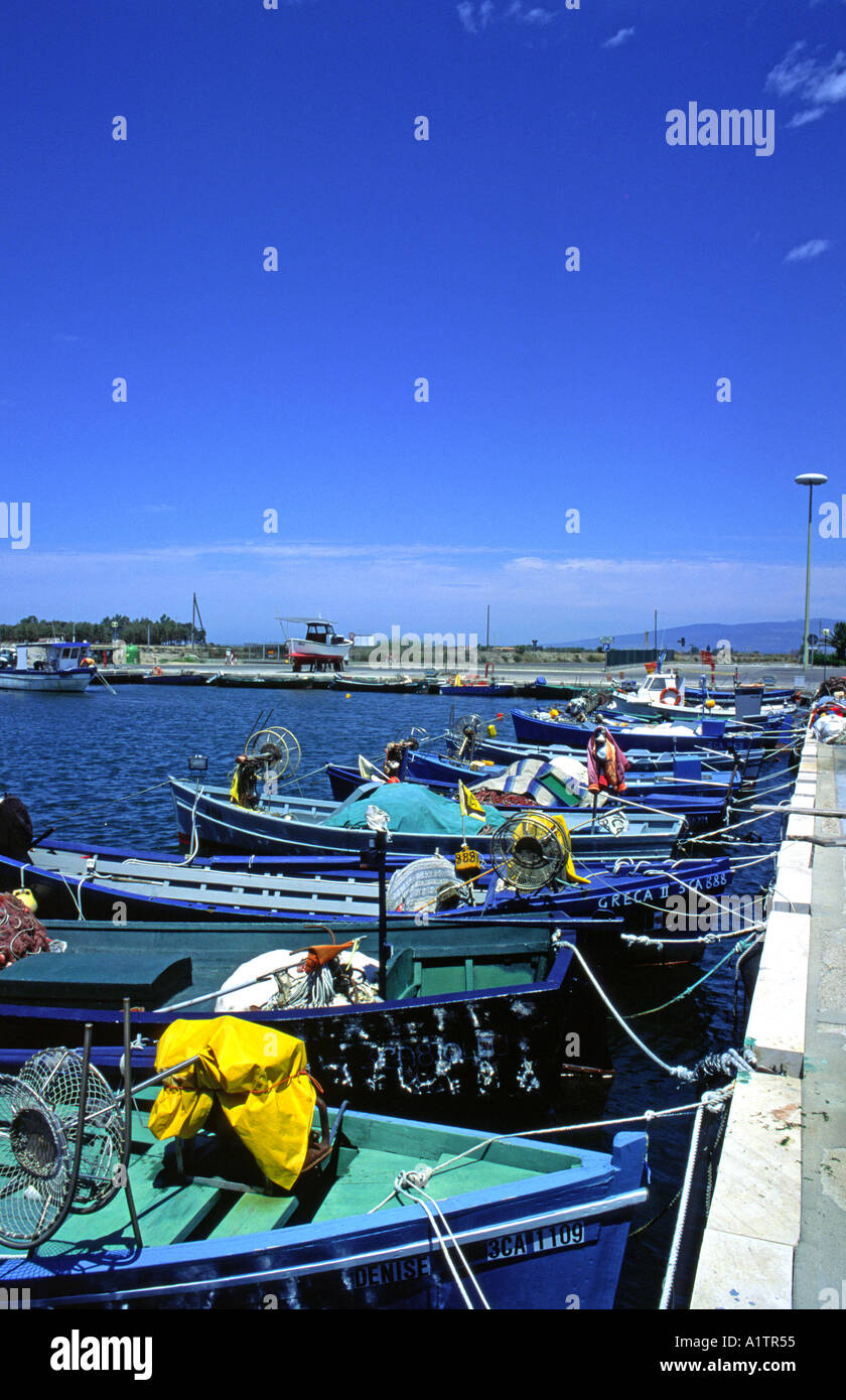 Wooden fish boat in typical colors in sardinia Stock Photo