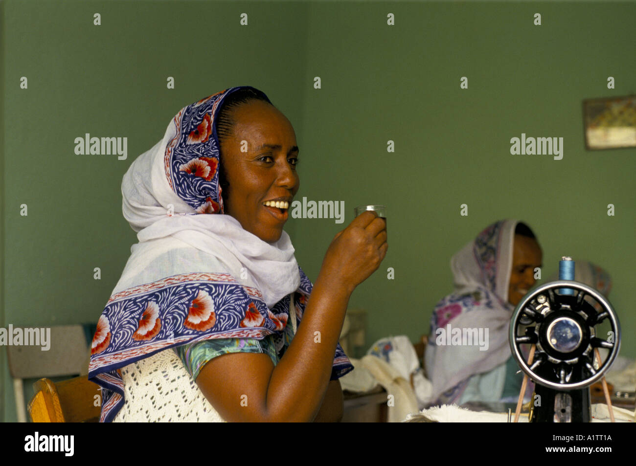 SEWING WORKSHOP IN ERITREA 1993 .Woman with sewing machine Stock Photo ...