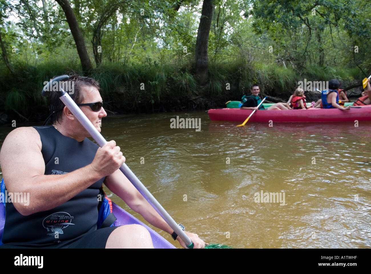 People canoeing on the Eyre river, Aquitaine, France. Stock Photo