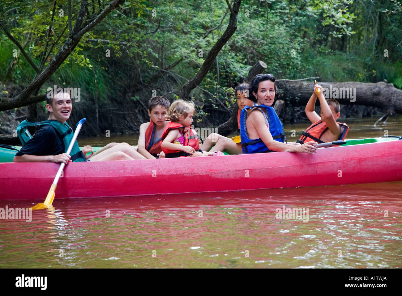 Group of people canoeing on the Eyre river, Aquitaine, France. Stock Photo