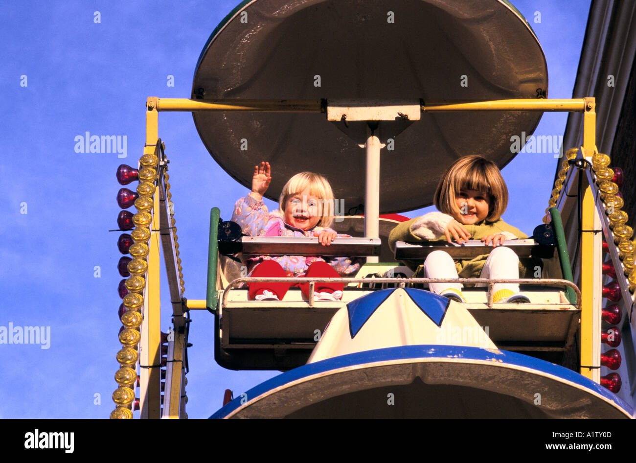 FAIRGROUNDS BANBURY FUNFAIR 1996. Two young children on small big wheel