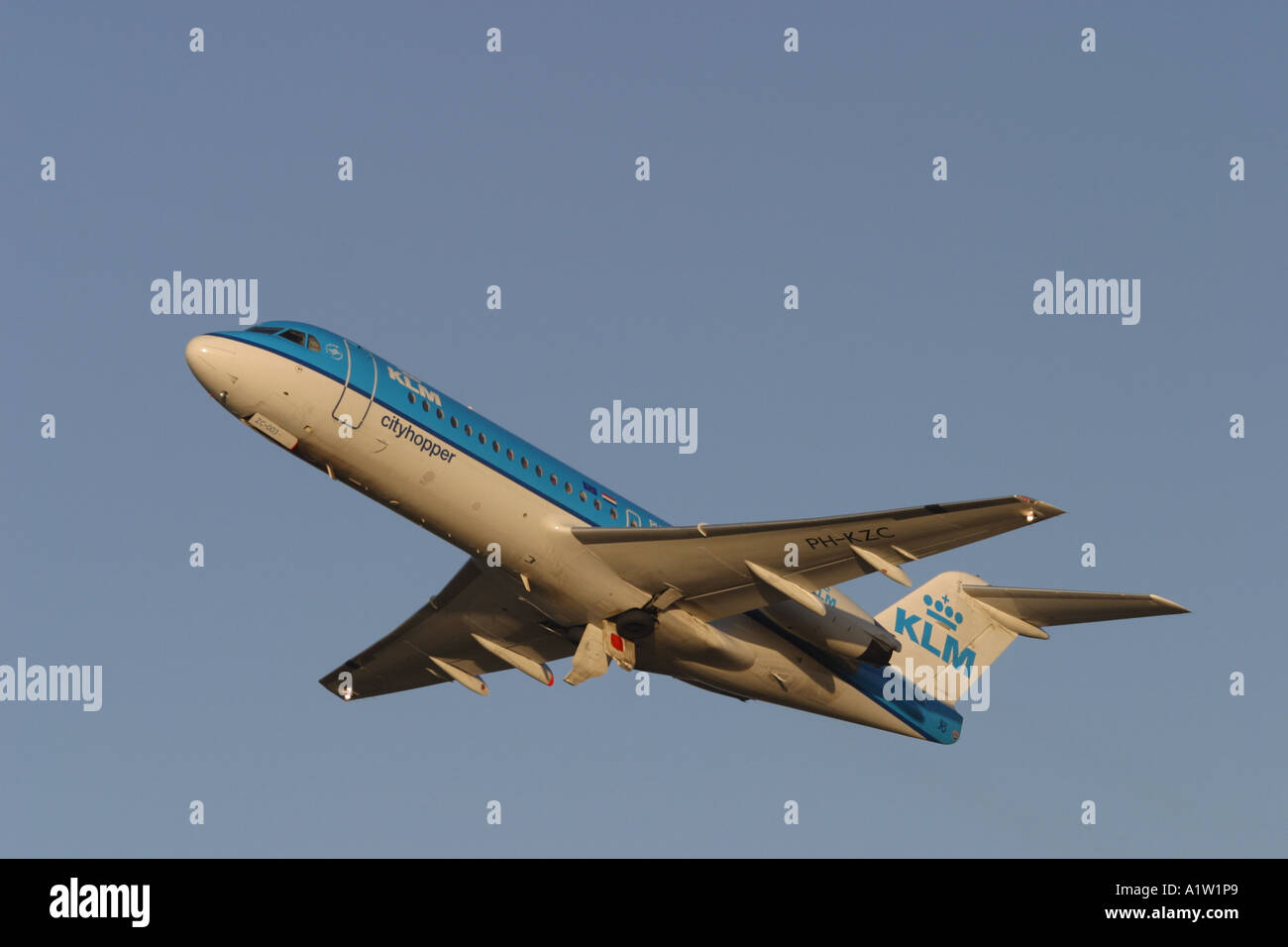 KLM Fokker 70 airliner taking off with gear retracting Stock Photo
