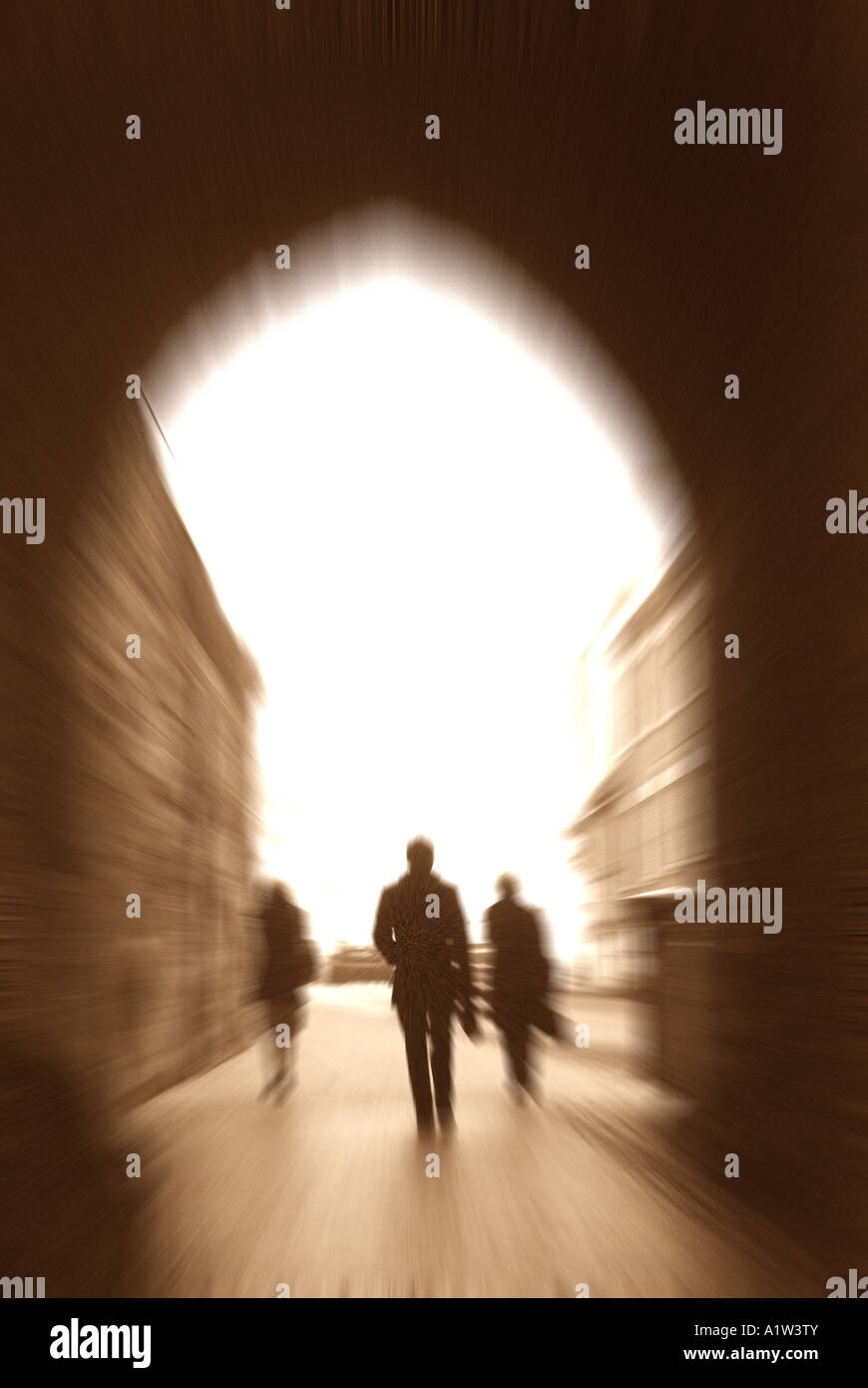 People walking under archway, Westgate, Warwick, Warwickshire, England, UK Stock Photo