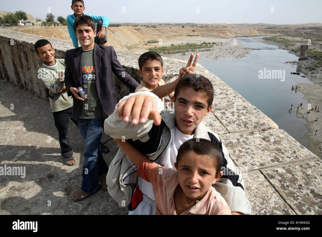 Cheeky Kurdish boys on bridge. Catakkopru, Eastern Turkey Stock Photo