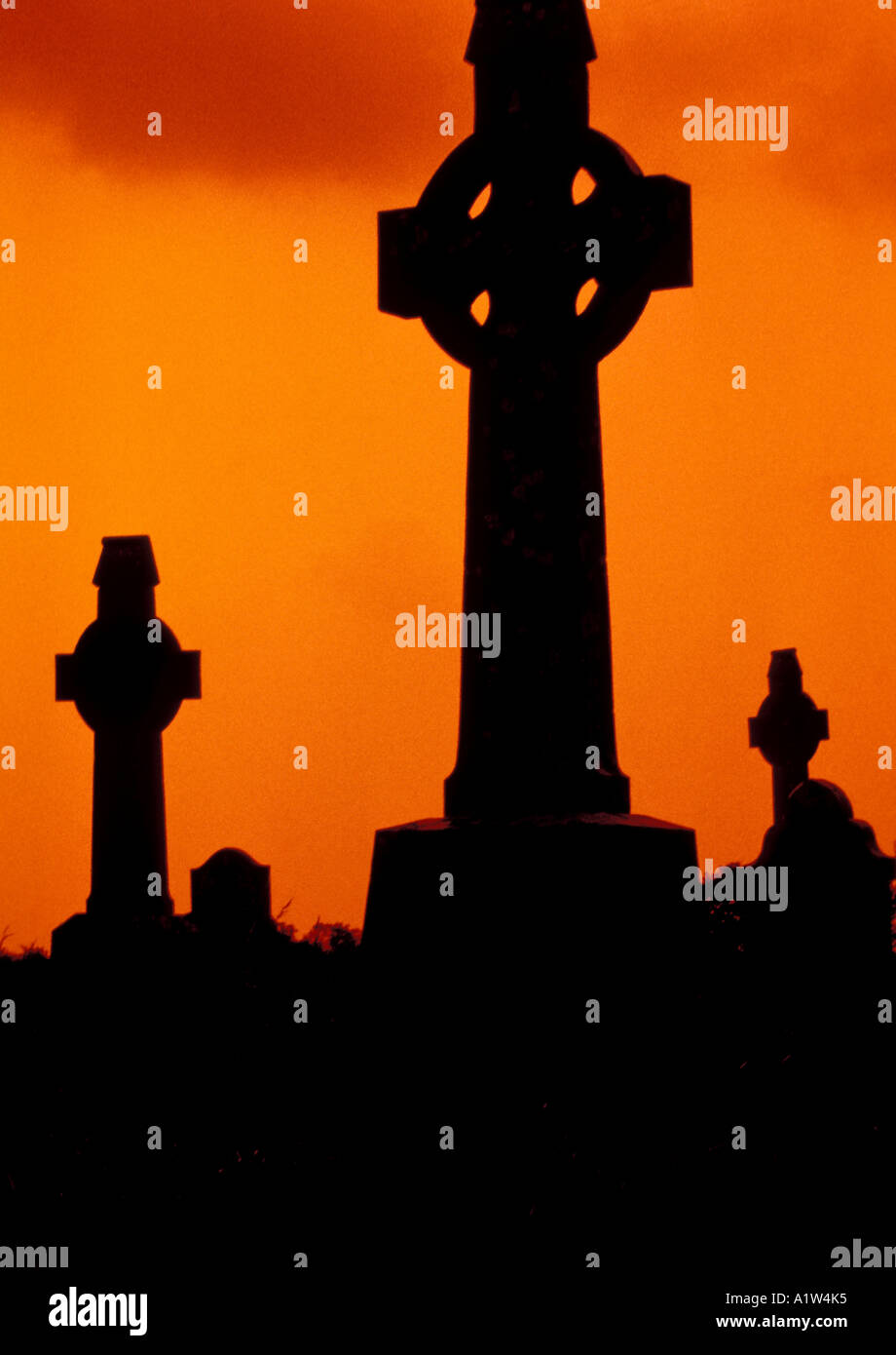 Ireland Eire celtic crosses silhouettes orange sky background dramatic iconic Irish image silo