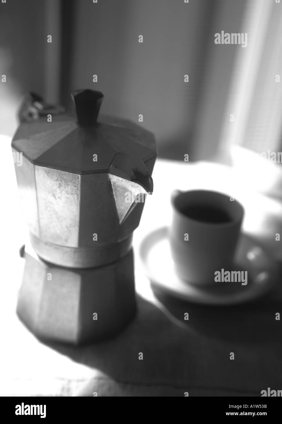 stove top Moka type espresso pot with demi-tasse cup Stock Photo