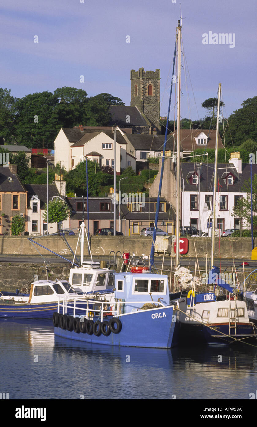 Stranraer Harbour on Loch Ryan early morning light catching boats with town behind Galloway Scotland UK Stock Photo