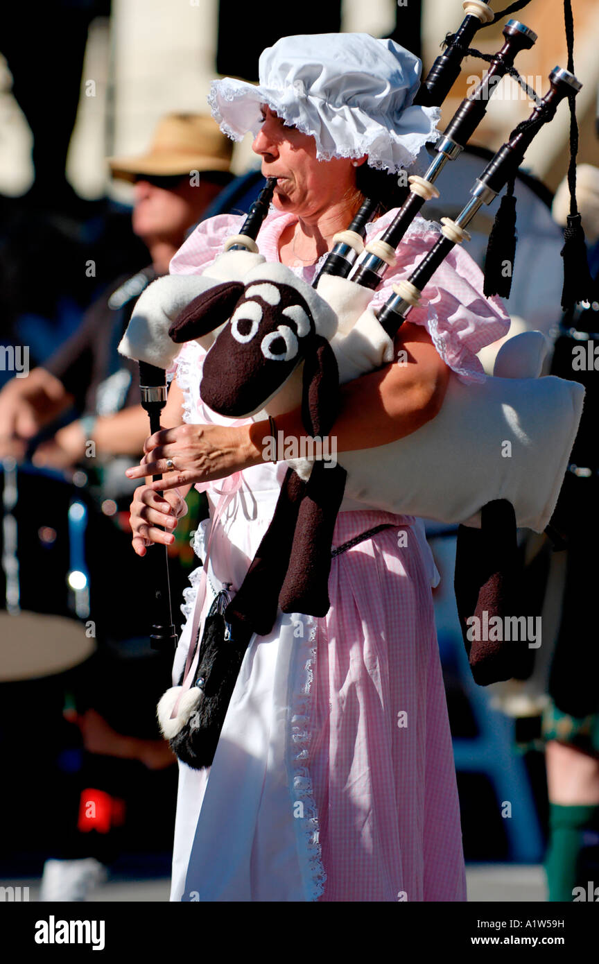 Costumed woman playing bagpipes at the Doo Dah Parade Pasadena California USA Stock Photo