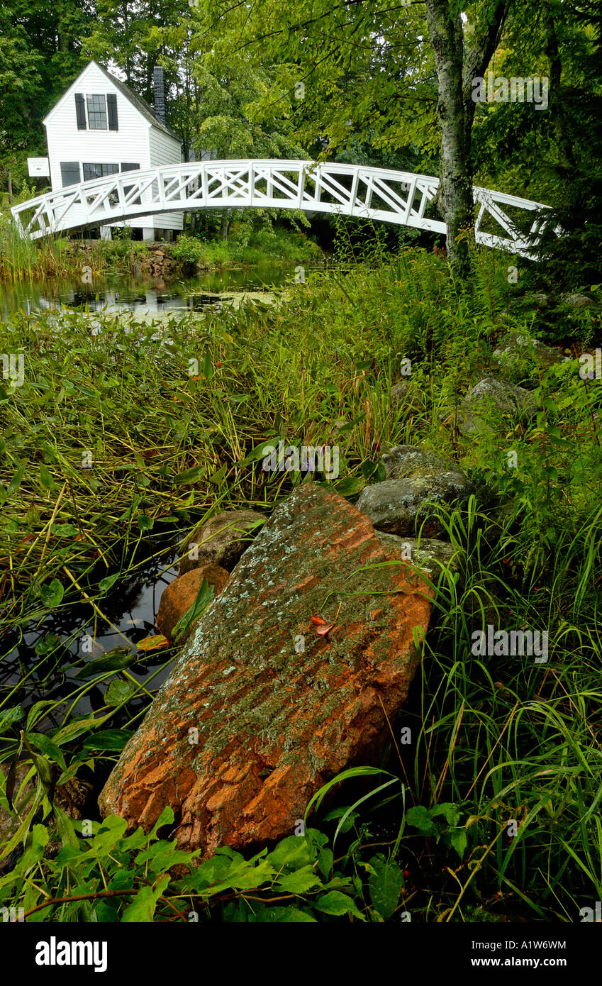Stock photo of a rainy day at the Selectmens house and arched wooden bridge Somesville Museum and Gardens Somesville Maine USA Stock Photo