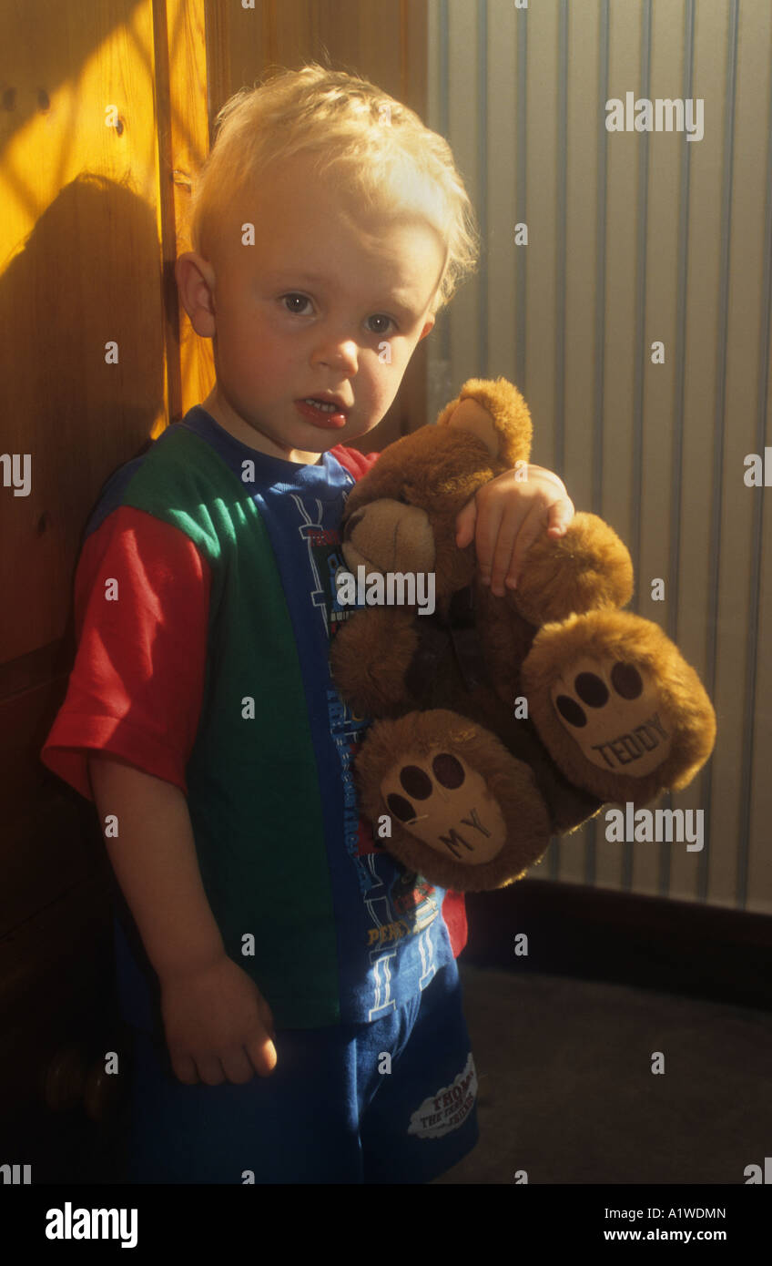 Little Boy Holding One Of His Teddy Bears Stock Photo - Alamy